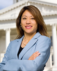 Portrait of California State Treasurer Fiona Ma wearing light blue