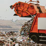 Garbage truck at dump