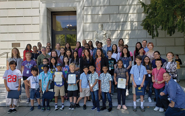 Treasure Ma and Chief of Staff Genevieve Jopanda join a happy group of children and parents who work in the State Treasurer’s Office on “Take Your Child to Work Day.”