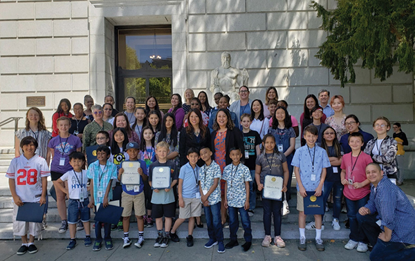 Treasure Ma and Chief of Staff Genevieve Jopanda join a happy group of children and parents who work in the State Treasurer’s Office on “Take Your Child to Work Day.” Treasure Ma and Chief of Staff Genevieve Jopanda join a happy group of children and parents who work in the State Treasurer’s Office on “Take Your Child to Work Day.”