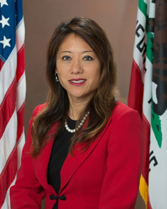 Portrait of California State Treasurer Fiona Ma wearing red