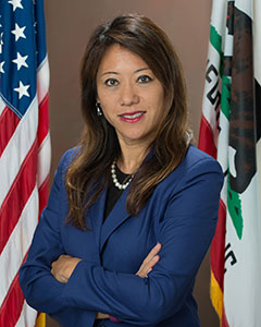 Portrait of California State Treasurer Fiona Ma wearing dark blue