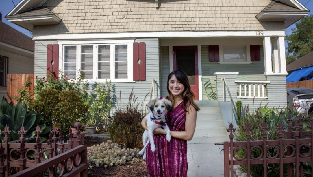 Juliana Maziarz standing outside home