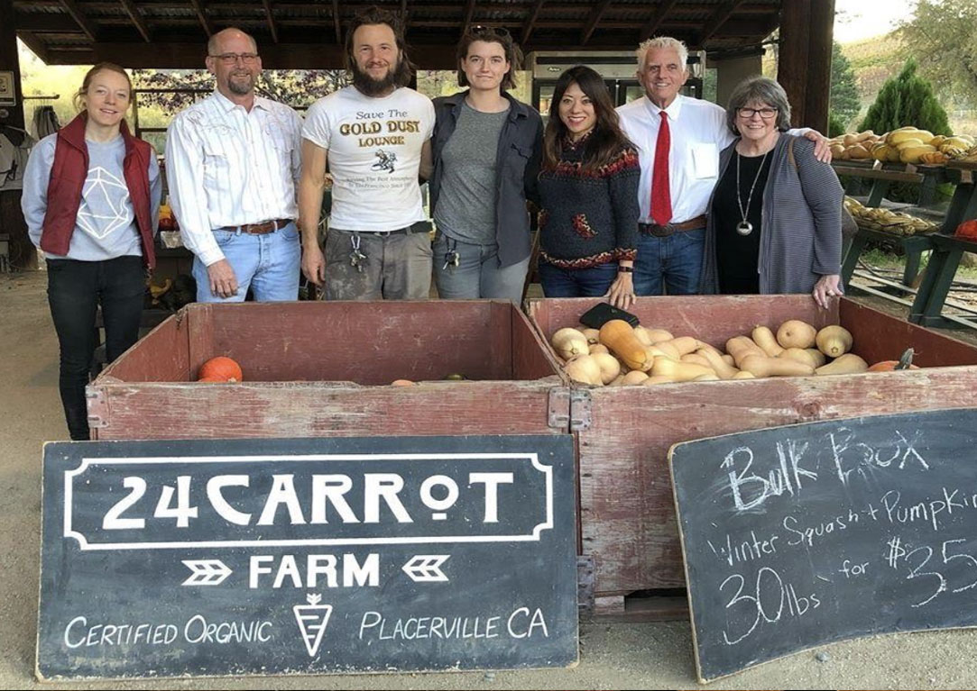 Visiting with friends of the 24 Carrot Certified Organic Farm owned by Bay Area native Ben Hansen. The farm stand operation joins with other local businesses to feed the local community. From left to right: farmhand Aly Schmaultz, El Dorado county Chamber of Commerce President Gordon Helm, Ben Hansen, farm manager Allison Ryan, Treasurer Ma, Seth Doulton of the Treasurer’s external affairs team, El Dorado County Chamber of Commerce CEO Laural Brent-Bumb. Visiting with friends of the 24 Carrot Certified Organic Farm owned by Bay Area native Ben Hansen. The farm stand operation joins with other local businesses to feed the local community. From left to right: farmhand Aly Schmaultz, El Dorado county Chamber of Commerce President Gordon Helm, Ben Hansen, farm manager Allison Ryan, Treasurer Ma, Seth Doulton of the Treasurer’s external affairs team, El Dorado County Chamber of Commerce CEO Laural Brent-Bumb.