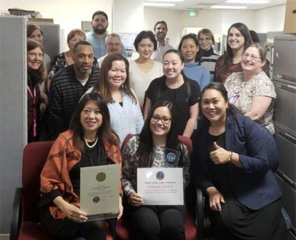 With March employee-of-the-month Jennifer Nguyen, a senior accounting officer in the Administration Division, surrounded by her colleagues. Other stand-out employees honored since January for going “above and beyond” include Ashley Peters, Business Services; David Palsha, the California Alternative Energy & Advanced Transportation Authority; Tawnia Starr-Contreras, the Treasurer’s Office; Justin Gustafson, California Alternative Energy & Advanced Transportation Financing Authority; and Sandra Kent, California Debt & Investment Advisory Committee.