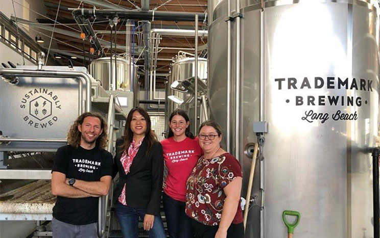 Treasurer Ma and California Alternative Energy & Advanced Transportation Financing Authority (CAEATFA) Executive Director Deana Carrillo (far right) visit the Trademark Brewery in Long Beach. Business owners Sterling and Ilana Steffan received a CAEATFA sales tax exclusion award of more than $156,000, allowing them to purchase $1.8 million in equipment and launch their business.