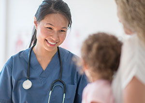 Female doctor with child patient