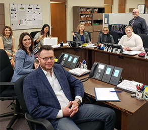 Treasurer Ma, top center, at the trading desk in the Investment Division. To her left is Investments Division Director Kristin Szakaly-Moore. Investment Division Assistant Director Jeff  Wurm is standing, far right. 