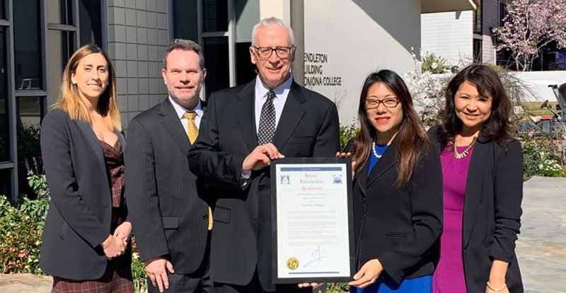 Treasurer Ma presenting Pomona College in Claremont with a certificate of appreciation