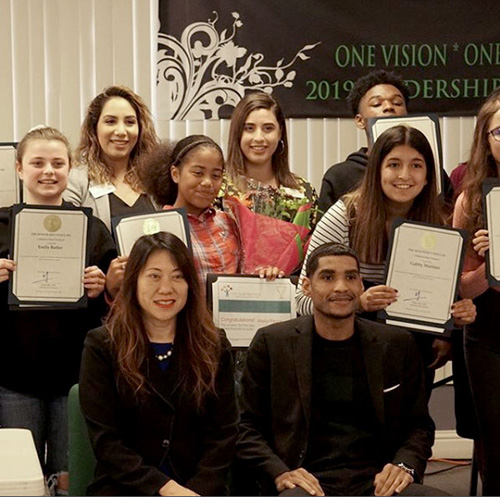 Treasurer Ma and Deputy Treasurer Jovan Agee with summit participants and their certificates of completion. 