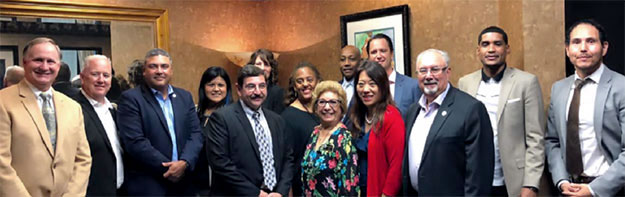 Treasurer Ma, Deputy Treasurer Jovan Agee, and staff pose with some of the locally elected officials representing High Desert communities that share an economic interest in the Virgin Trains USA project Treasurer Ma, Deputy Treasurer Jovan Agee, and staff pose with some of the locally elected officials representing High Desert communities that share an economic interest in the Virgin Trains USA project