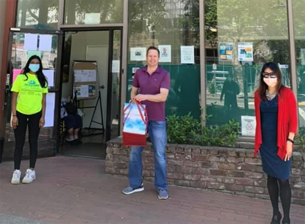 Avanti Ramraj and Treasurer Ma hand off donated masks in Sacramento to C.O.R.E Medical Clinic Inc Avanti Ramraj and Treasurer Ma hand off donated masks in Sacramento to C.O.R.E Medical Clinic Inc